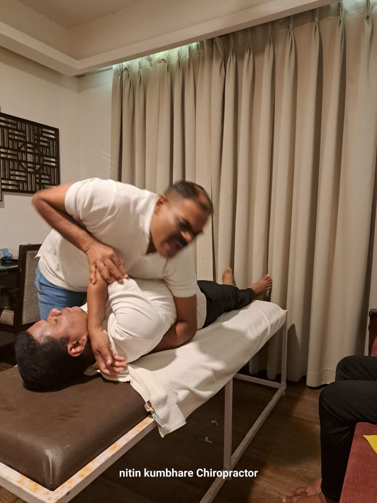 Nitin Kumbhare treating patient